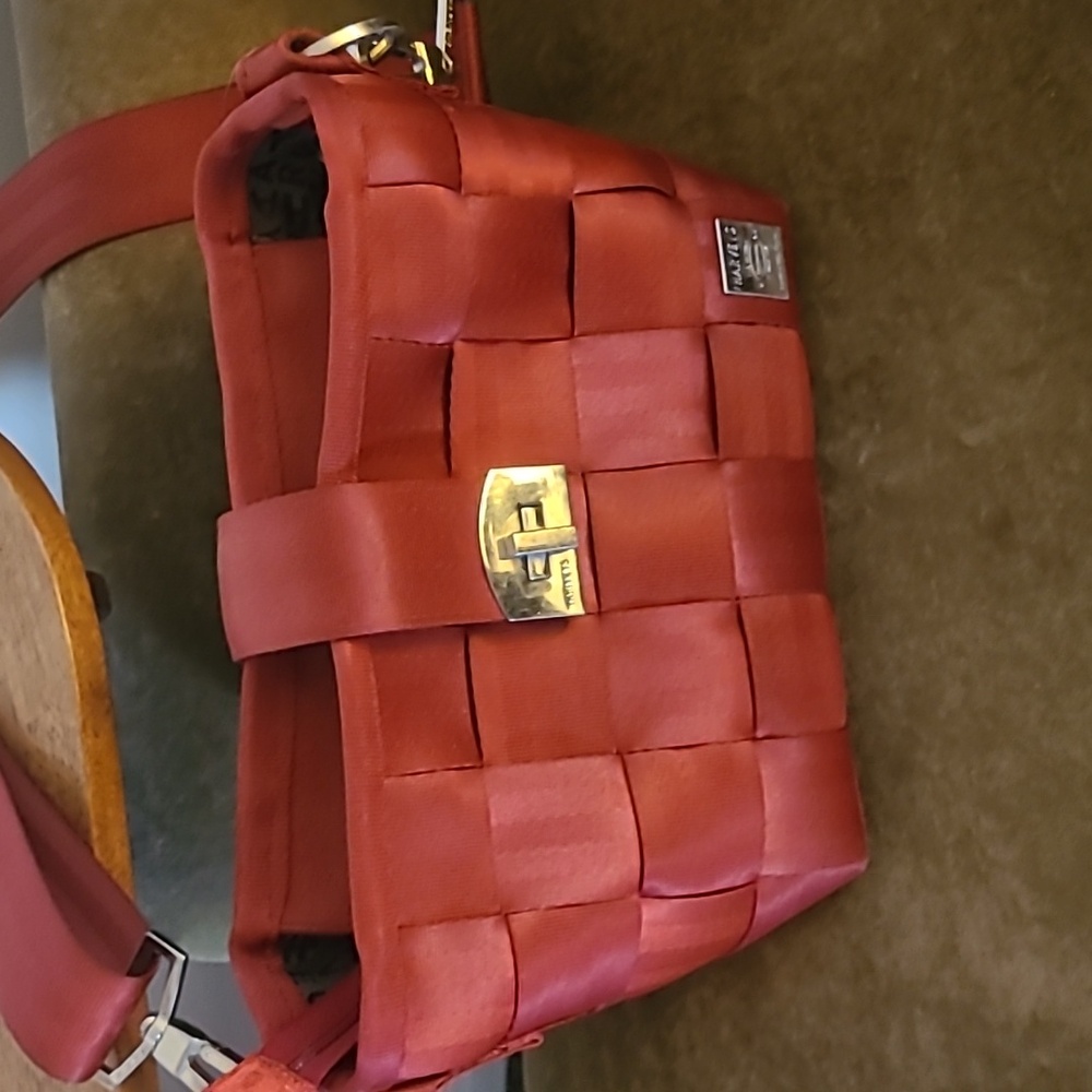 Harvey's red plPurse over the shoulder